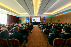 delegates seated in front of the presentation