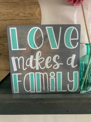 Love makes a family sign