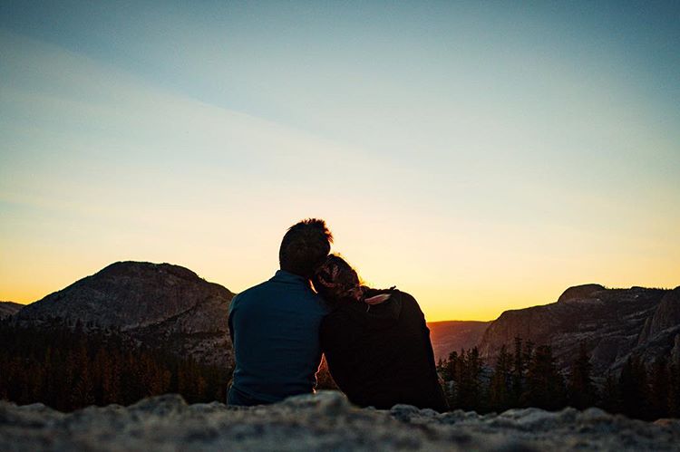 a couple camping together and watching the sunset