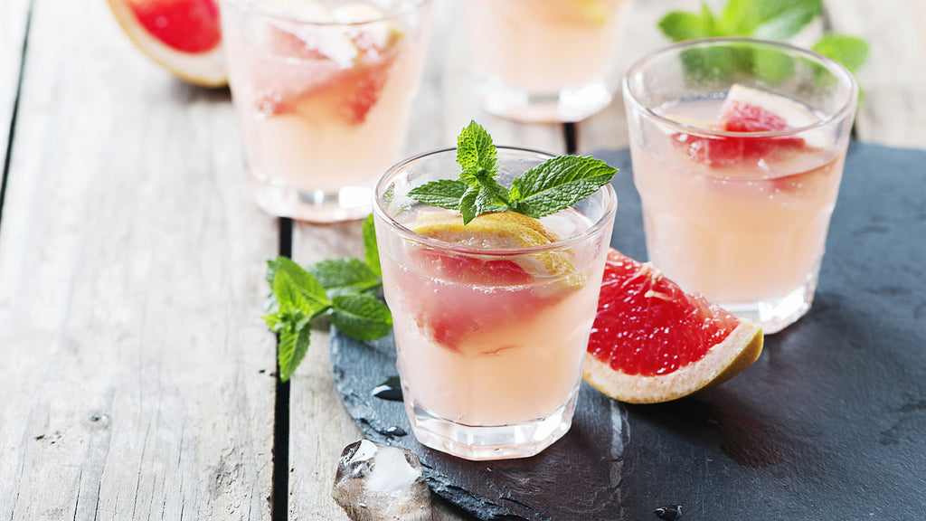 Refreshing summer drink recipe with grapefruit and mint leaves.