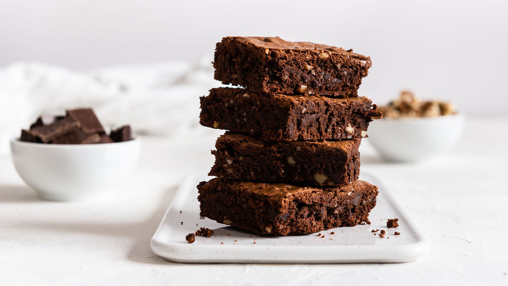 Indulgent brownies with rich chocolate and chopped nuts.