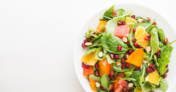 Delicious salad with persimmon citrus and almonds.