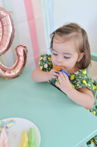 baby eating a cupcake