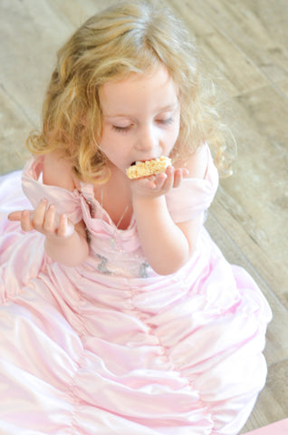 girl enjoying her rice krispy treat