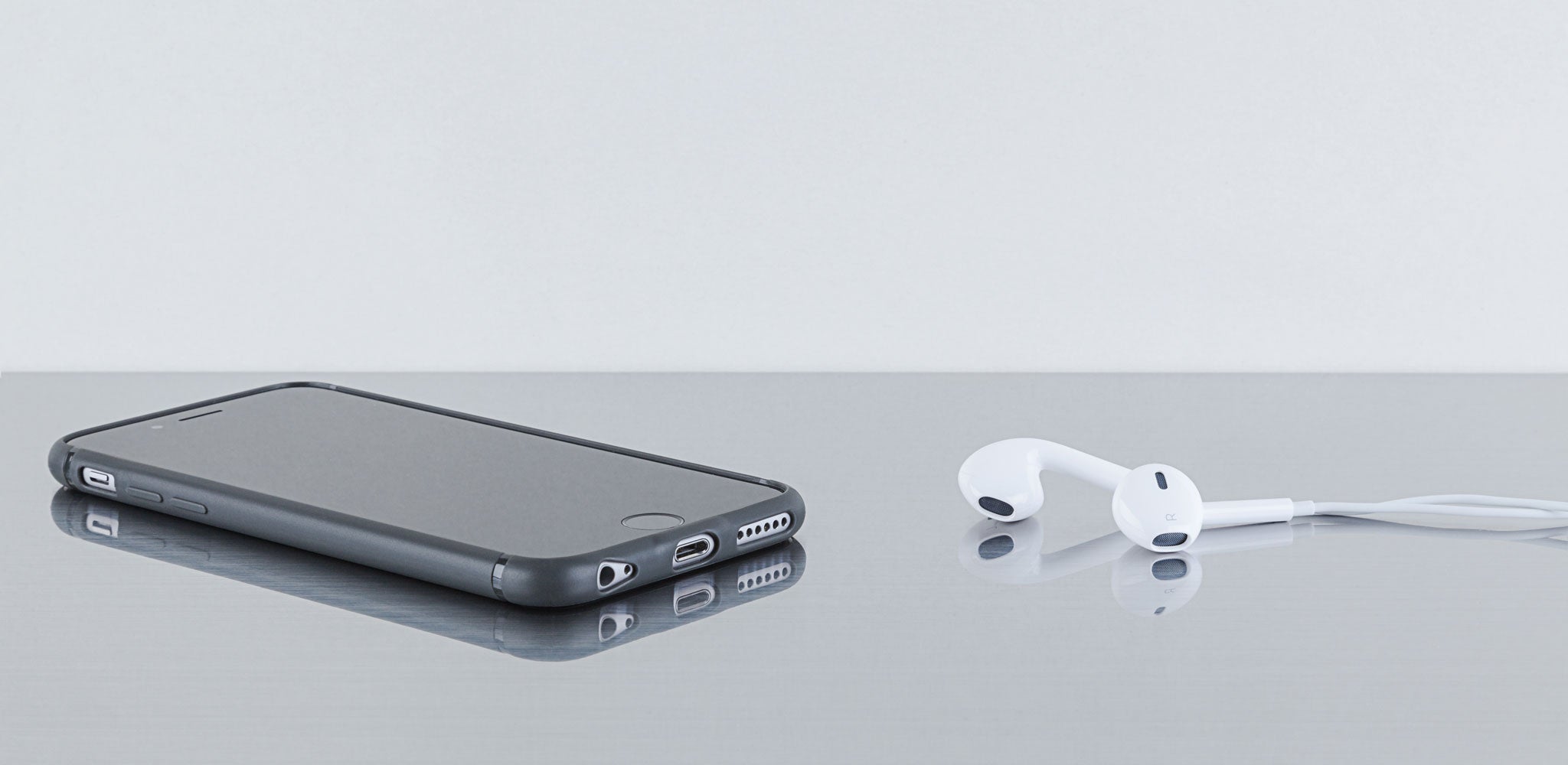 The Sheath | Super slim, shock-absorbing, minimalist iPhone case | earbuds