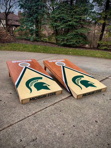 Another cornhole board with a few of our MSU decals