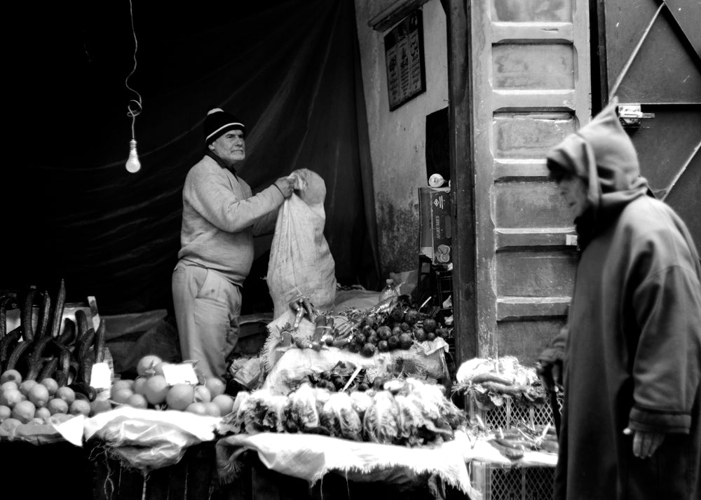 A man works to set up a shop in the Medina of Fez.