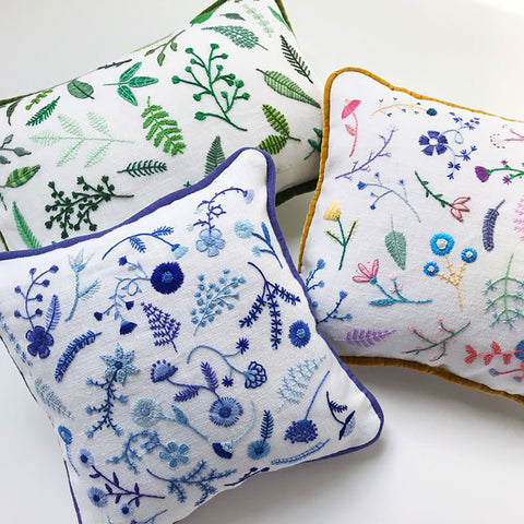 https://www.happycactusdesigns.com/products/hand-embroidered-blue-flowers-pillow