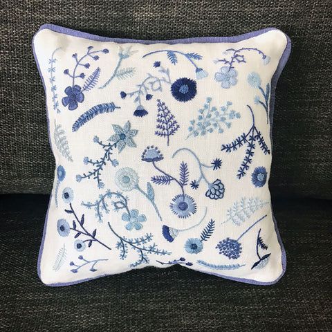 https://www.happycactusdesigns.com/products/hand-embroidered-blue-flowers-pillow