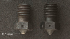 Hardened steel nozzle wear carbon fiber