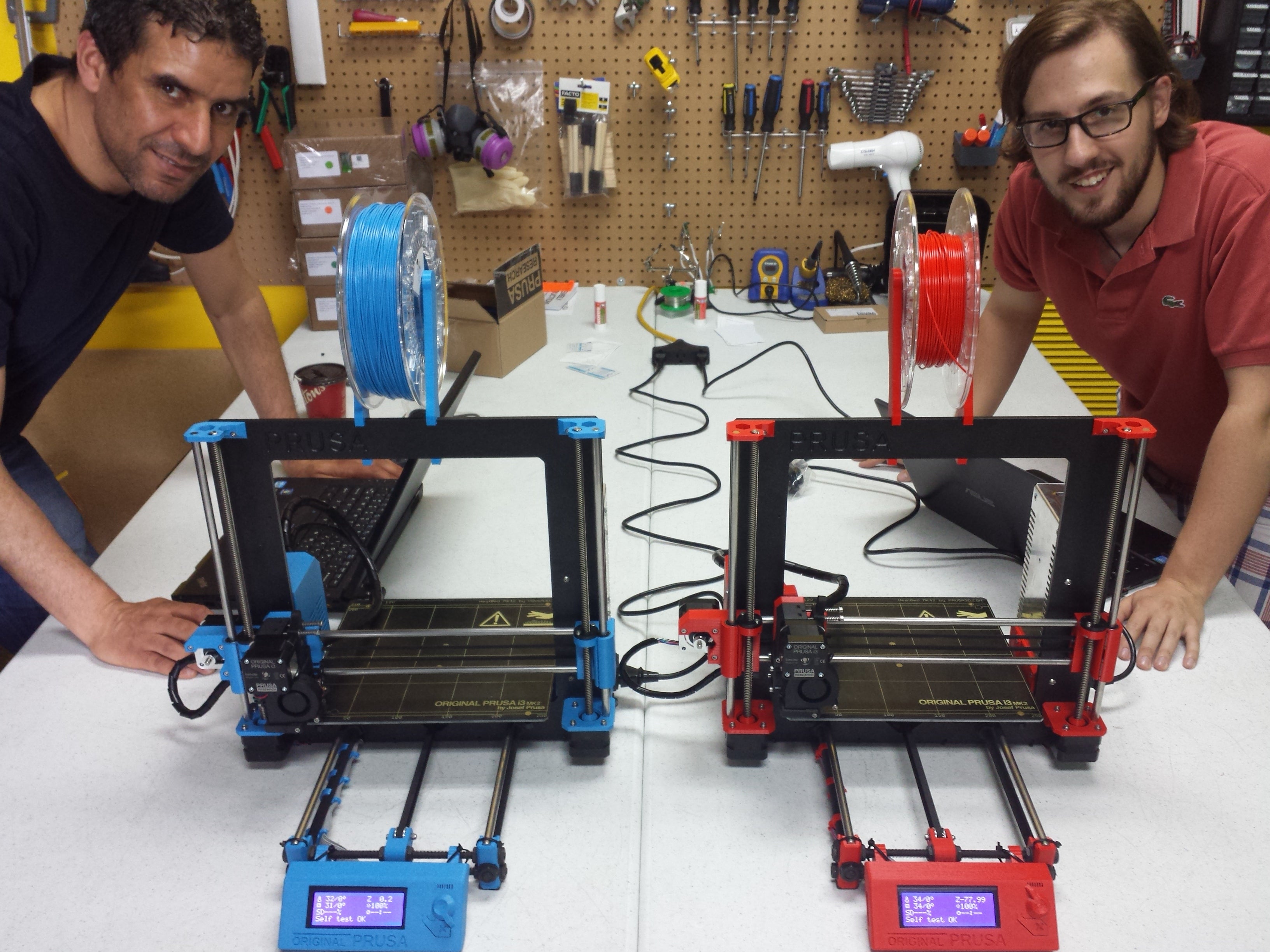 Picture of two assembled Prusa i3 MK2 3D printers by Voxel Factory
