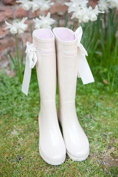 Stunning white Wellington boots with bow