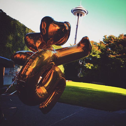 gold balloons and space needle