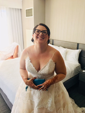 bride with her custom blue clutch