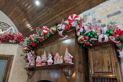 Gingerbread house and trees on shelf ledge in kitchen