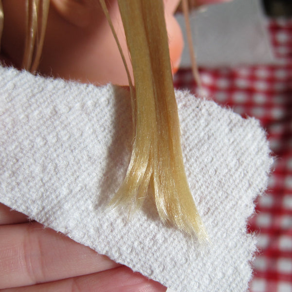 Doll hair with paper towel as curling paper