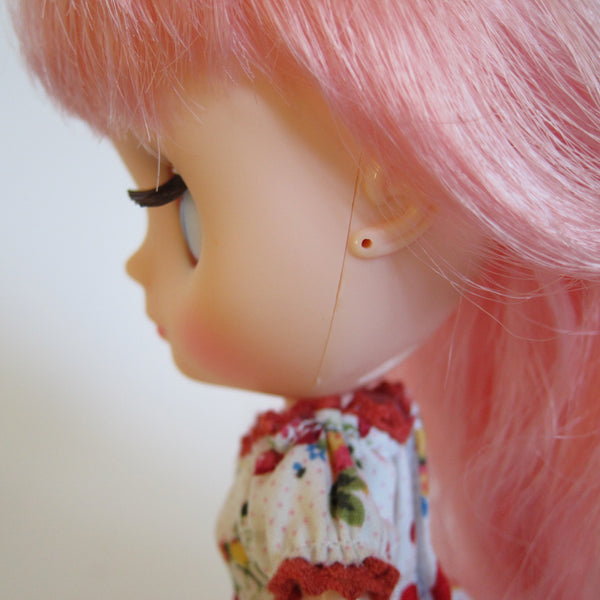 Middie Blythe with pierced ears