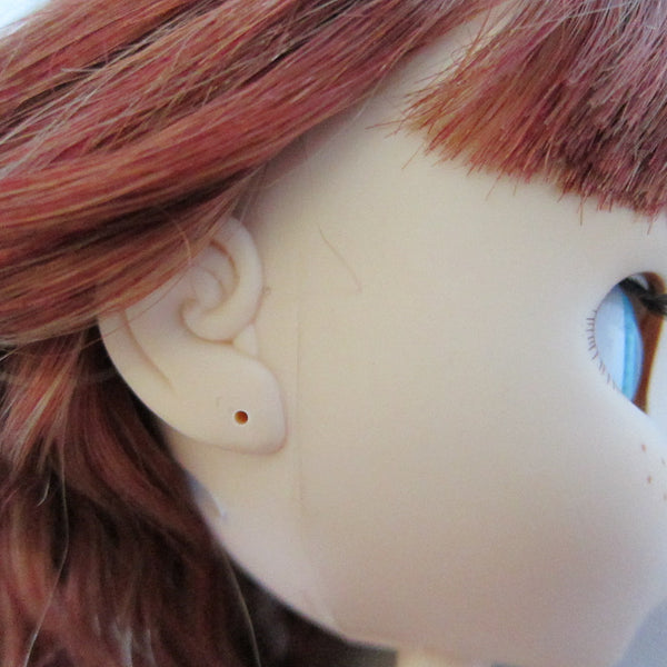 Doll with pierced ears