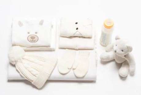 Baby clothes, newborn baby sleepsuit, baby bottle, baby hospital bag, baby vests, baby mittens.