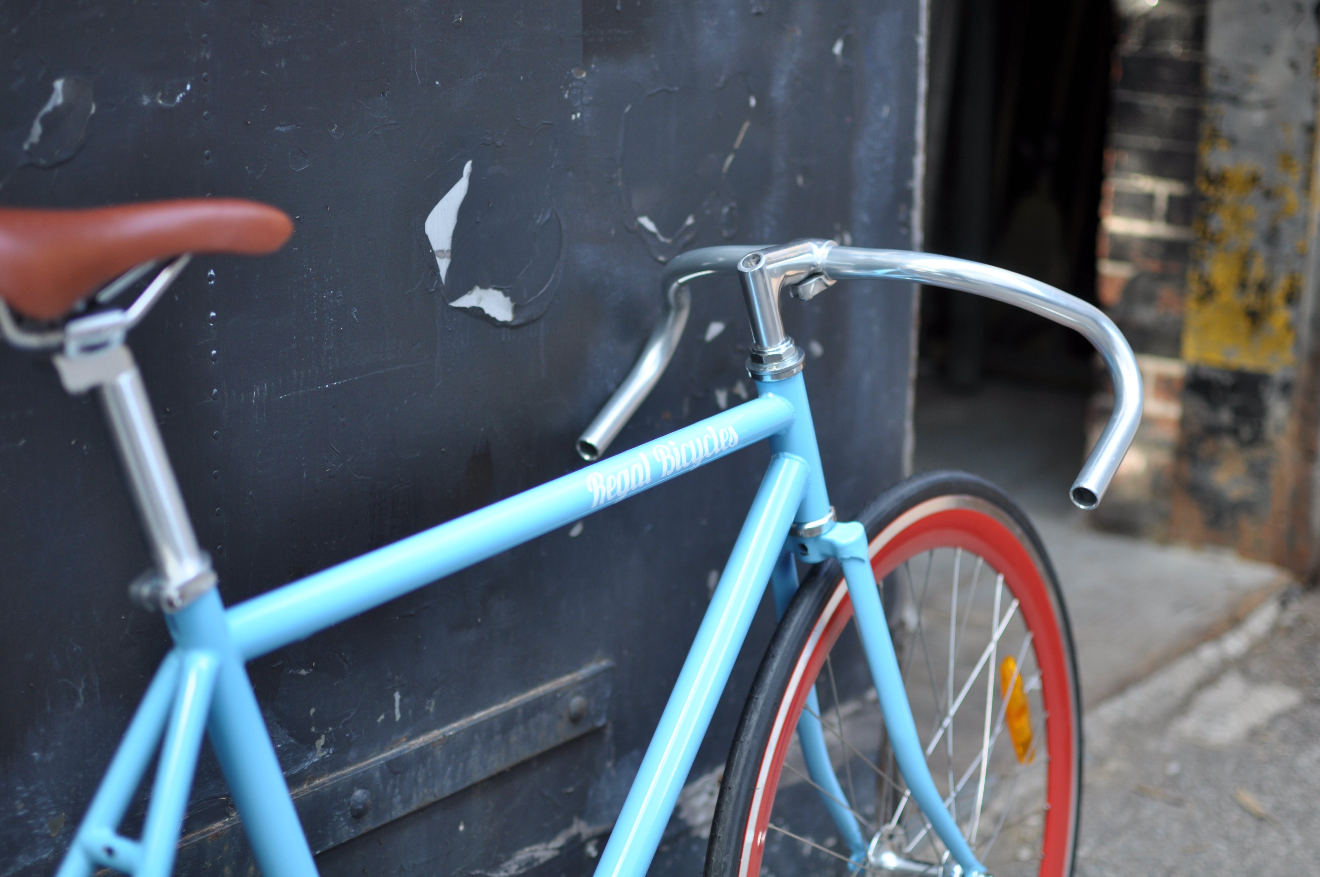 Fixed Gear Bike by Regal Bicycles with Red Rims and Drop Bars Used For Commuting