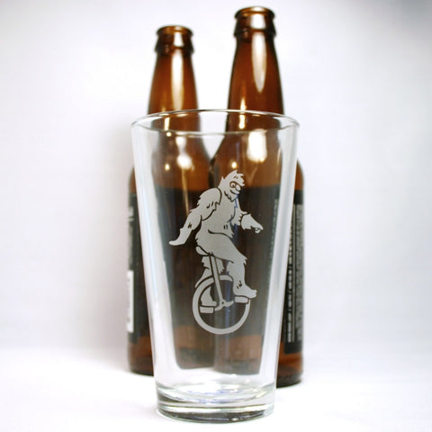 sasquatch pint glass with beer bottles