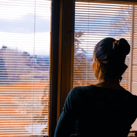 Woman looking out a window