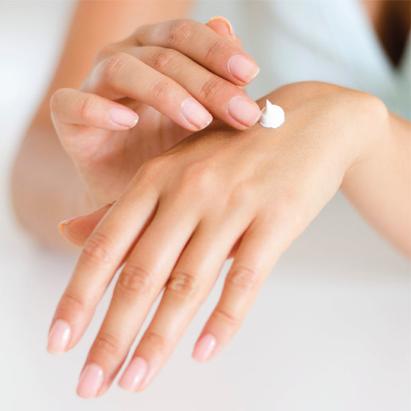 putting on hand lotion