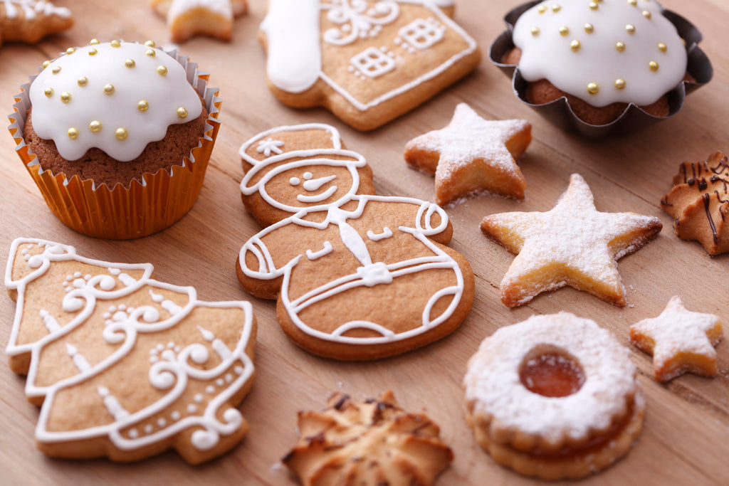 an image of gingerbread cookies and other various Christmas cookies