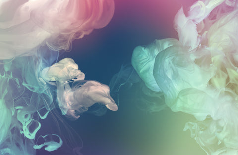 closeup of colorful vape cloud made with atomizer no people