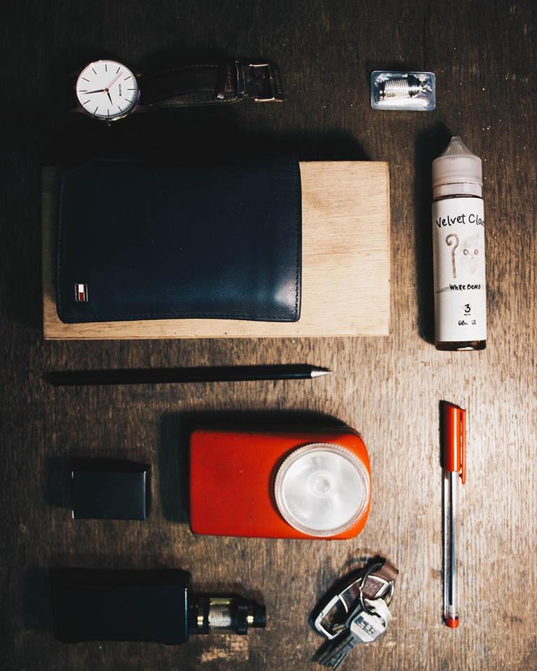 picture of an e-liquid bottle from Velvet Cloud and various items on a table