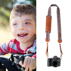 The Titus Fotostrap is named after Titus Daily, from the Fotolanthropy story "Unexpected Joy". You can visit www.Fotolanthropy.com to watch Titus's, and more inspiring true stories of everyday heroes.