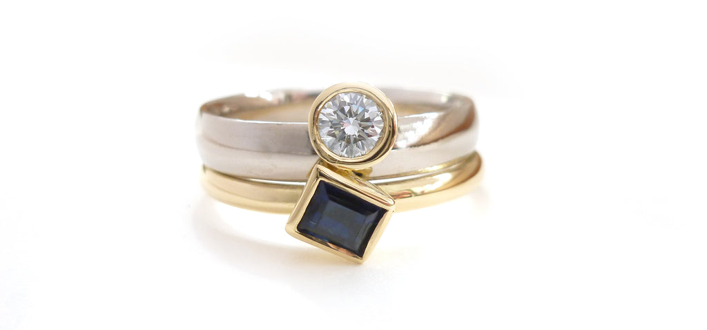 bespoke white and yellow gold two band sapphire and diamond ring