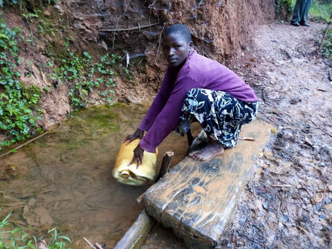 Woman Gathering Water from the Unprotected Spring