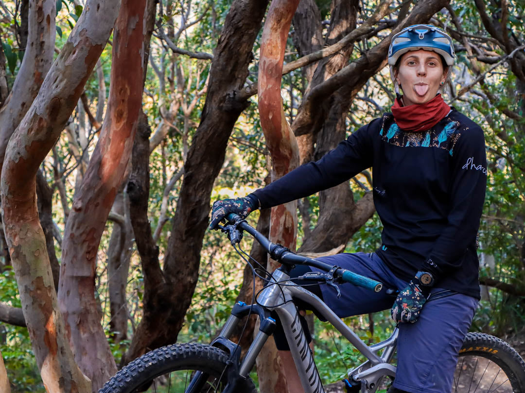 Candace sticking her tongue out mountain biking