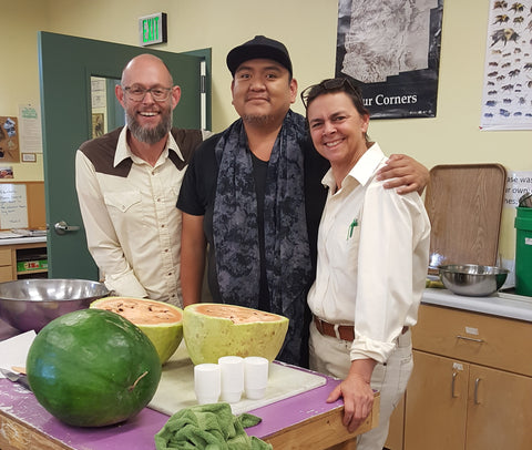cutting melon from Jon Naranjo's farm at Native Seeds/Search Harvest Party