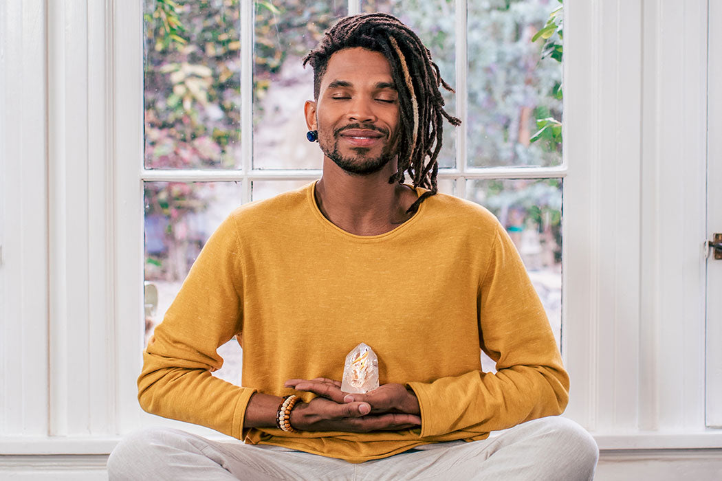 a man sitting in front of a window