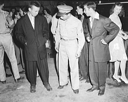 Three men wearing 1940s attire in an event