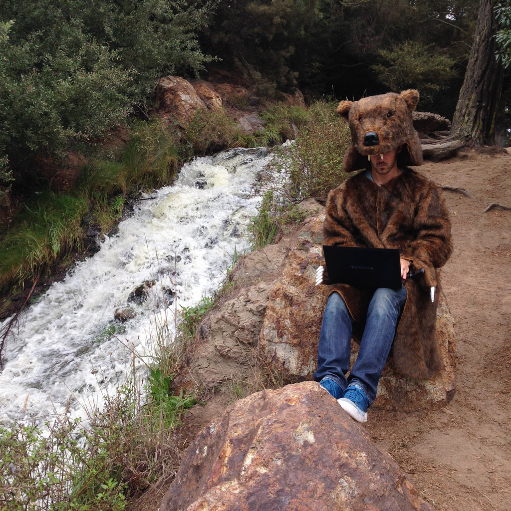 Bear sitting by the river about to unload on people's promos folders