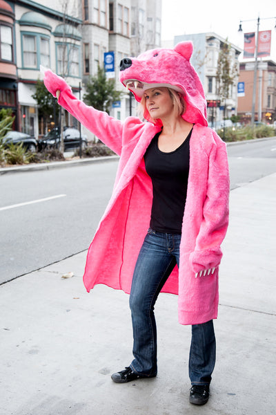 Pink Griz Coat hailing a cab