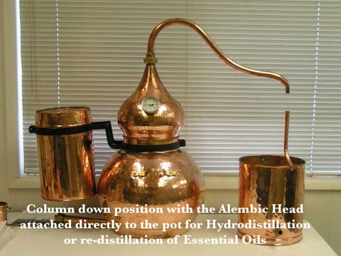 copper alembic distiller with the column down