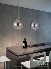 Kitchen island with Kinetic pendant by Zuo Modern