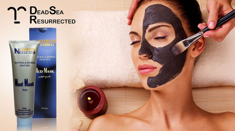 Natural Secrets Dead Sea Mud Mask being applied to woman's face