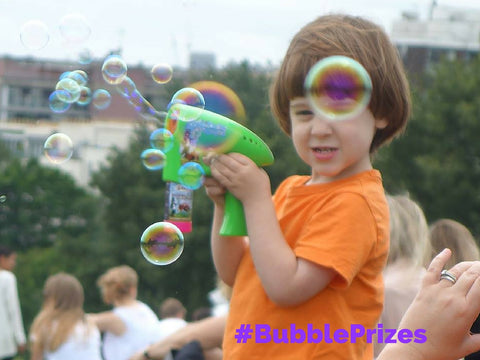 bubbliser bubblegun bubble inc bubbleinc little boy loving bubbles primrose hill London green bubblegun