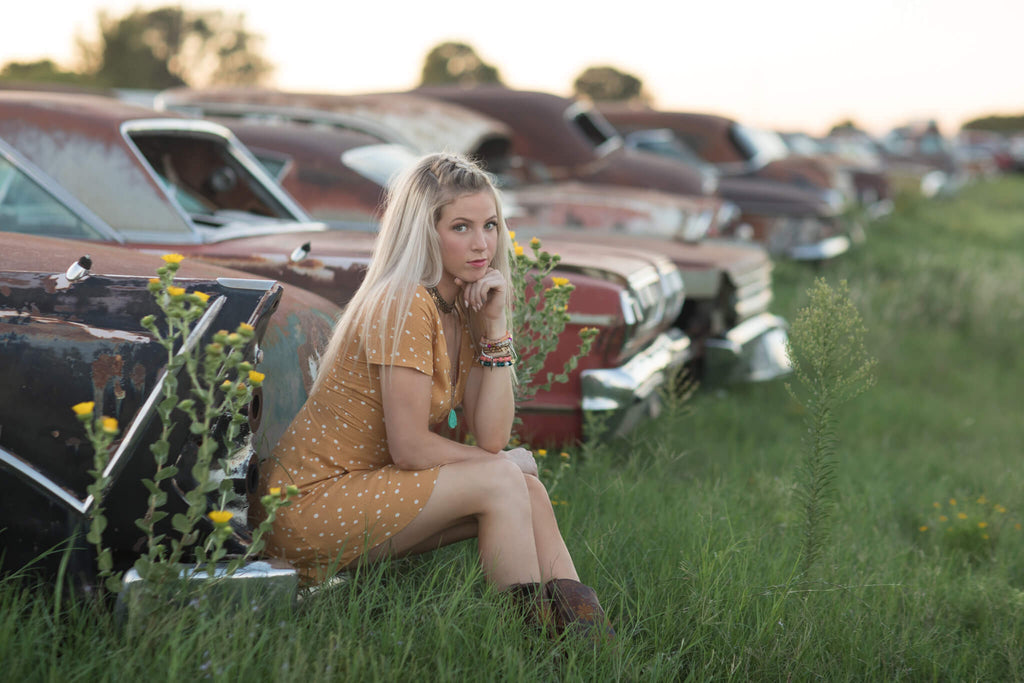 girl sitting on car dark and moody edit