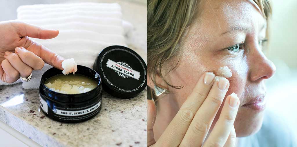 The woman dips her finger in Sugar Scrub and applies it to face