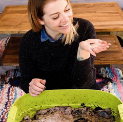 Woman with worms for compost