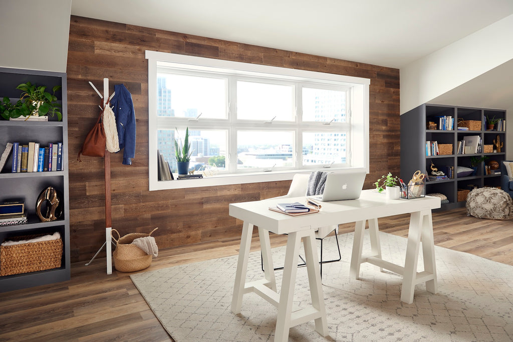 A contemporary home office with a modern reclaimed wood wall that surrounds a picture window