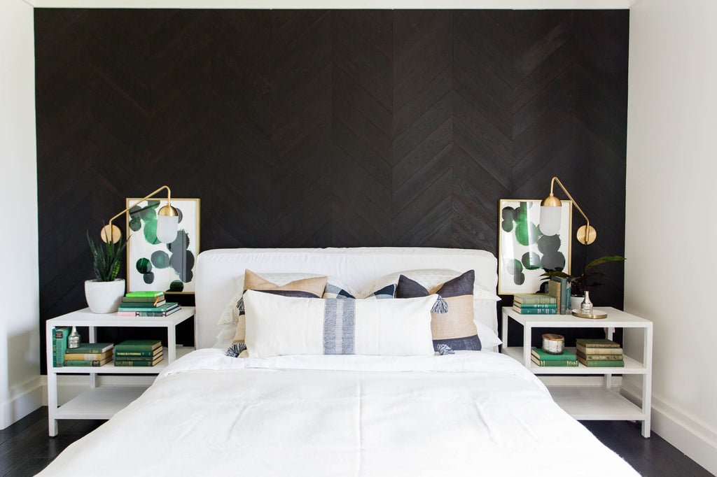  Charcoal wood interior wall paneling done in a beautiful chevron design creates wow factor in a master bedroom.