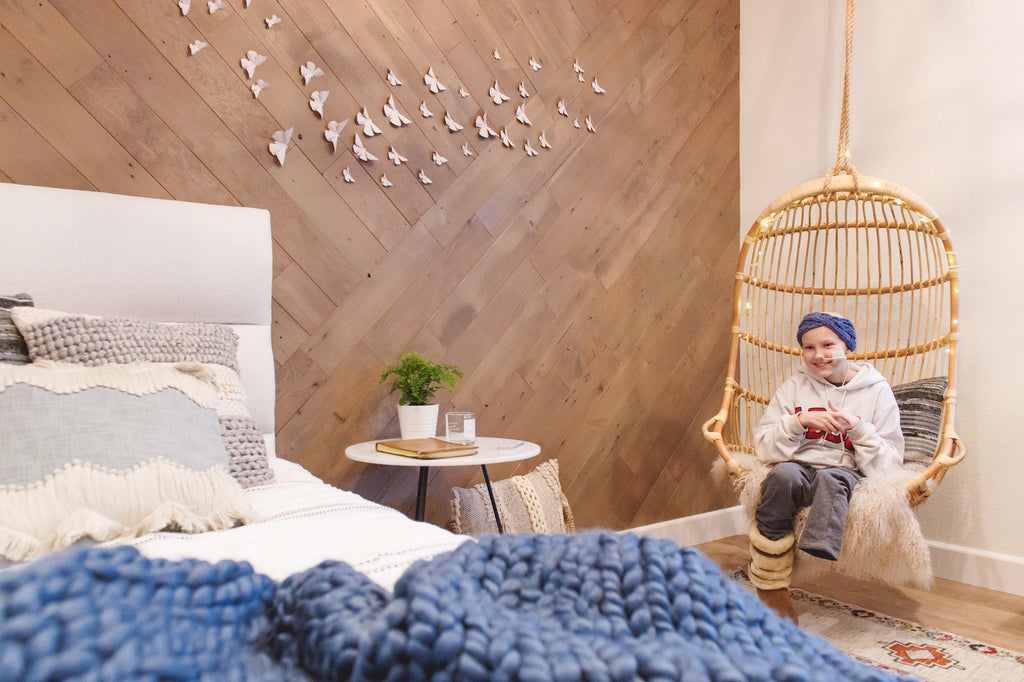 Keeley enjoying her new reclaimed wood wall that was done in a geometric pattern.