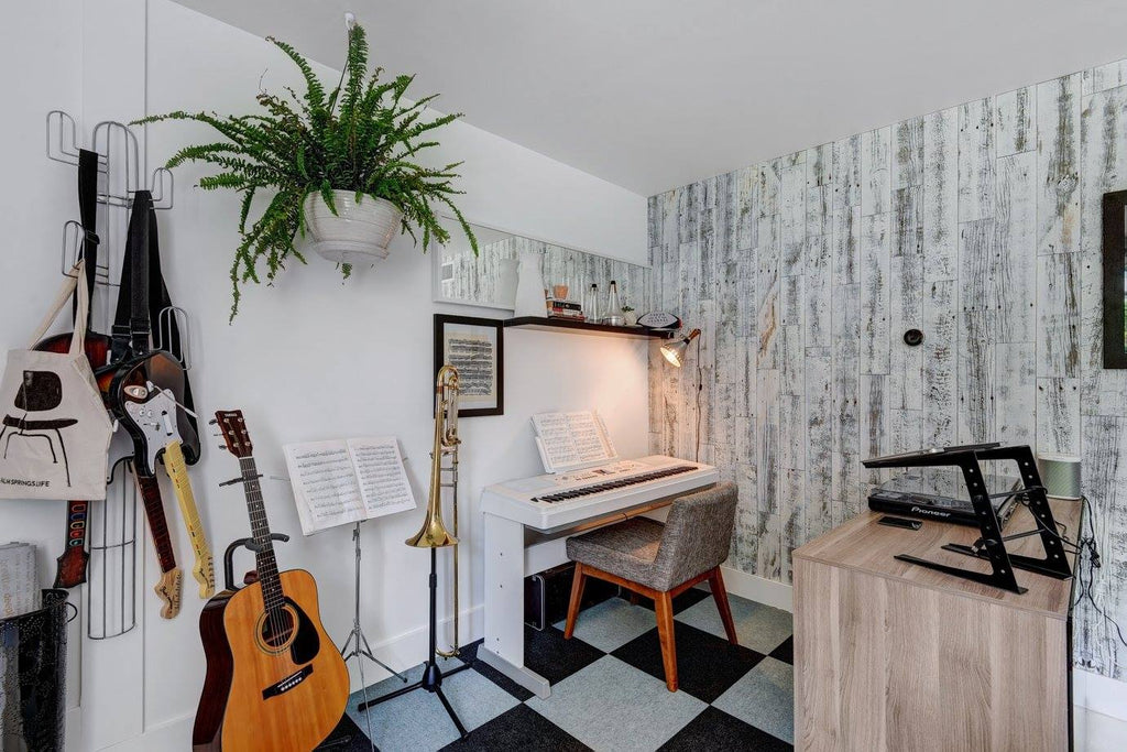 A rustic white peel and stick wood accent wall in a home music room.